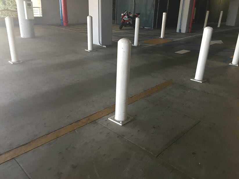 Bollard installation and parking lot striping in Seguin, Texas