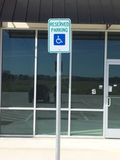 Signage in parking lot at storefront 