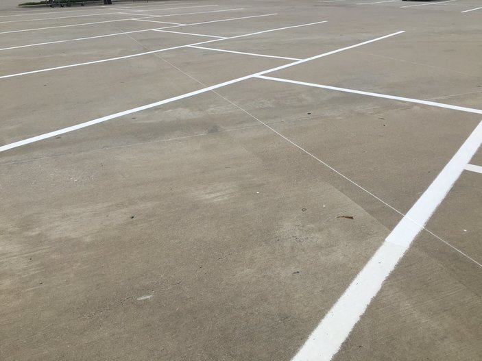 striped concrete parking lot